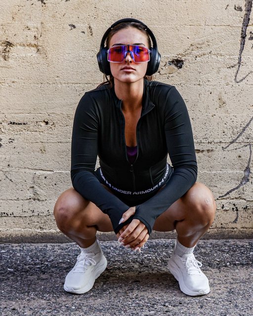 Athlete wearing headphones and mirrored sunglasses