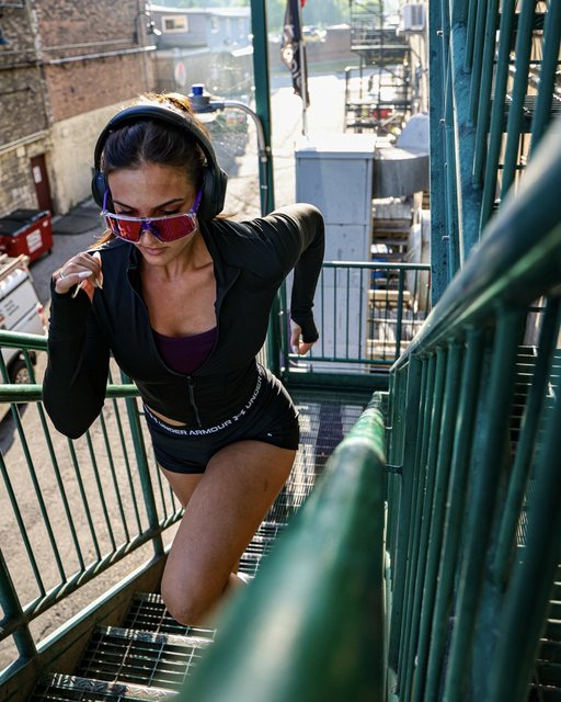 Athlete running up an outdoor staircase