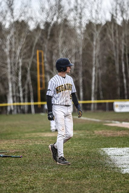 Baseball player on a rain-soaked field