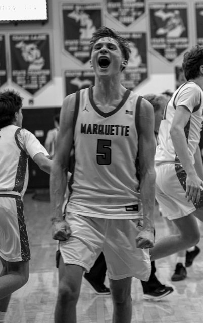 Black-and-white basketball celebration with player number five