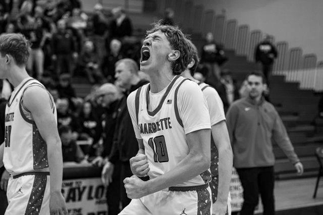 Black-and-white portrait of a basketball player looking up