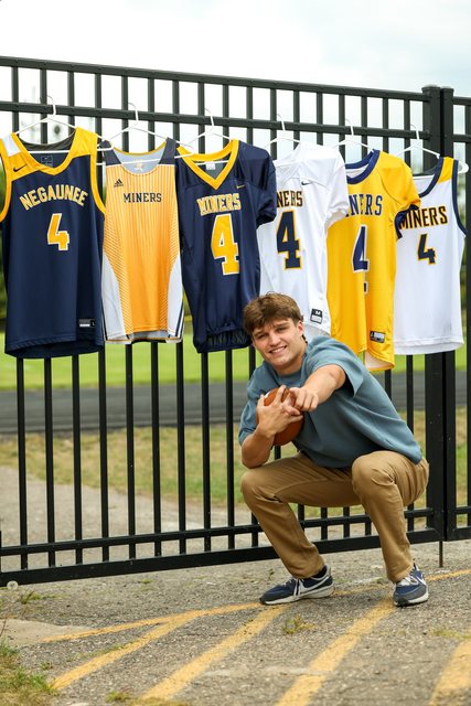 Athlete portrait surrounded by basketball jerseys