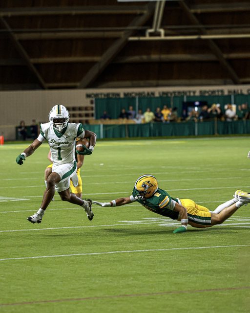 Football action inside the Superior Dome
