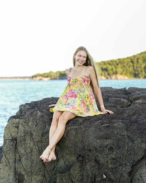 Portrait beside the lake on shoreline rocks