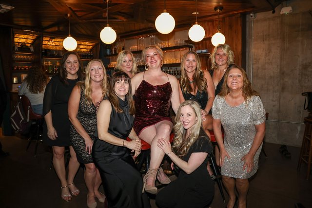 Group portrait inside an event venue