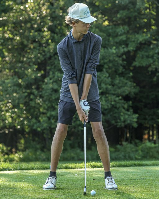 Golfer putting on the green