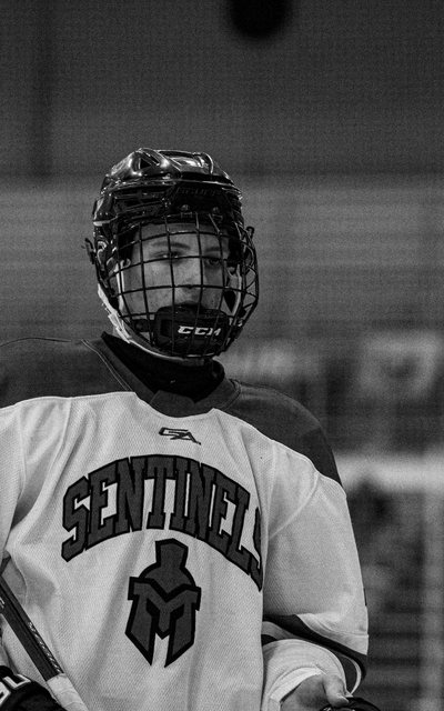 Black-and-white portrait of a Sentinels hockey player