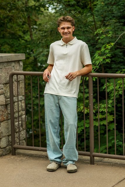 Portrait beside a wooded bridge