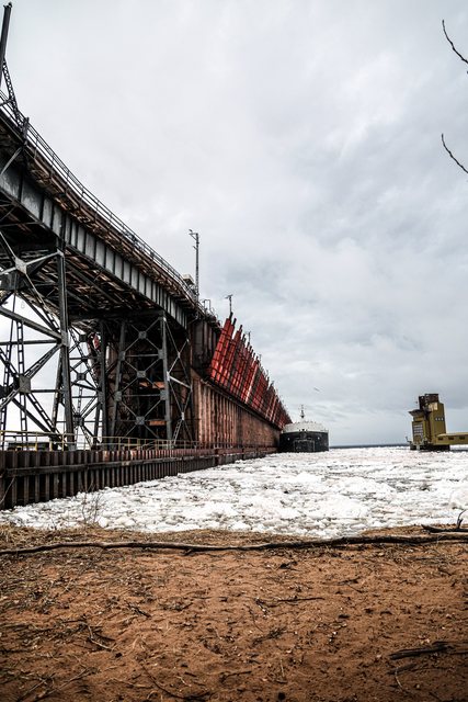 Snow-covered ore dock along the shoreline
